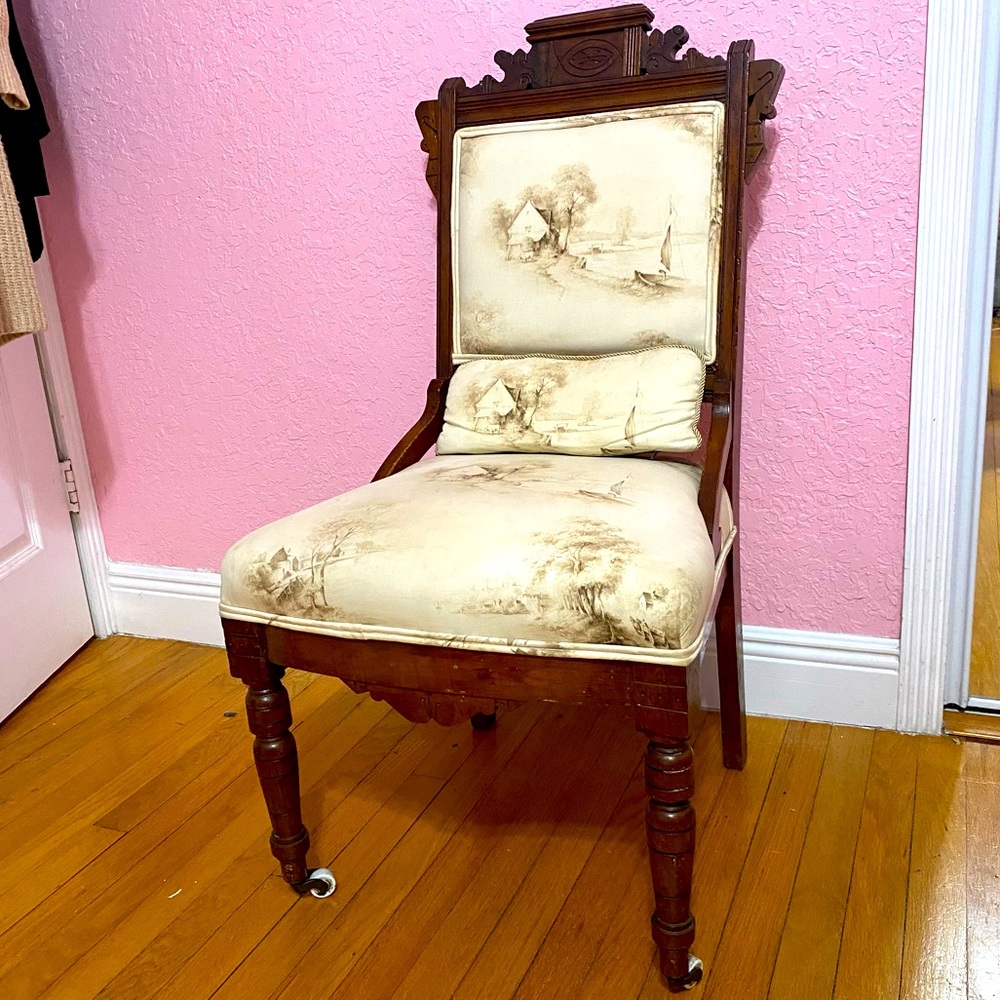 Vintage wooden chair w/ front wheels and pillow